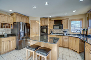 Photo for 670 Norton Street, Hammond, WI - Listing #6137051 Spacious kitchen features maple cabinets, granite countertops, newer appliances, a double oven, and corner pantry.