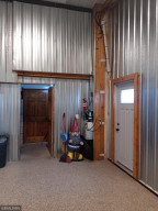 Photo for 90917 240th Street, Austin, MN 55912 - Listing #6176986 Walk-through to main floor bathroom and Laundry room.. Again this building has in-floor heating along with forced air,