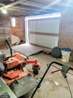 Photo for 90917 240th Street, Austin, MN 55912 - Listing #6176986 Dry storage inside the barn with overhead door for equipment.