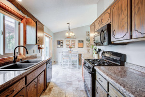 Photo for 7812 29th Street N, Oakdale, MN 55128 - Listing #6193596 Last view of the kitchen here, looking toward the dining area. Yes, a gas range, and that kitchen sink is Corian.