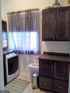 Photo for 90917 240th Street, Austin, MN 55912 - Listing #6176986 Laundry for master though far end of the bathroom.