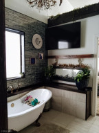 Photo for 90917 240th Street, Austin, MN 55912 - Listing #6176986 Enjoy a fire from the tub side as well! Stand alone tub with more great tile work!