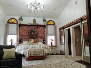Photo for 90917 240th Street, Austin, MN 55912 - Listing #6176986 Ceiling has ship lap under that amazing chandelier. Closet and room entrance on the right side of the room with sliding doors.