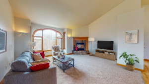 Photo for 4491 Hadley Valley Road NE, Rochester, MN 55906 - Listing #6198490 large window facing the north living room space with fireplace