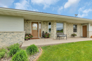 Photo for 714 5th Street NW, Richmond, MN 56368 - Listing #6199191 Outside front entry has large protected overhang perfect for sitting and added protection for plants, outdoor decor etc from wind and rain.