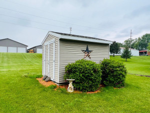 Photo for 810 4th Avenue SW, Plainview, MN 55964 - Listing #6219431 Storage shed with water ran underground to corner landscaping of the shed.