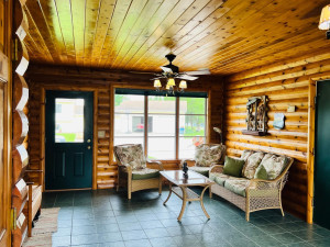 Photo for 810 4th Avenue SW, Plainview, MN 55964 - Listing #6219431 4 season between garage and house that has a coat closet and double doors to the garage and free standing stove to heat. Also enjoy with surround sound.