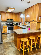 Photo for 810 4th Avenue SW, Plainview, MN 55964 - Listing #6219431 Custom made cabinets and newer stainless steel appliances & surround sound.