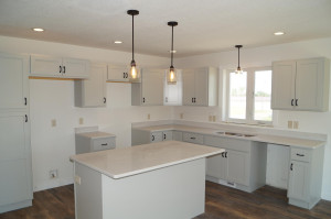 Photo for 807 24th Avenue NW, Austin, MN 55912 - Listing #6205036 Kitchen with quartz countertops and pendent lighting