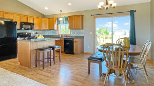 Photo for 1015 166th Street, Hammond, WI - Listing #6222408 Kitchen features black appliances, beautiful backsplash and natural woodwork.