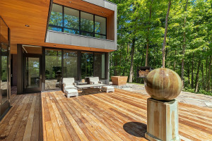 Photo for Bovey, MN 55709 - Listing #5497223 Stone fountain on the back patio, hemmed in by mature hardwood trees.