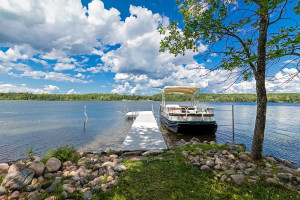 Photo for Bovey, MN 55709 - Listing #5497223 A clearing on the northeast edge of the property has a campground area, fireplace and this dock. A sandy swimming public beach is just across the lake.