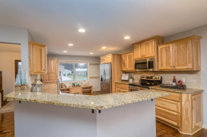 Photo for 2159 Erin Court, New Brighton, MN 55112 - Listing #5691861 Pull up a stool for informal eating on the granite peninsula overlooking the rich hickory cabinets and granite counter tops.