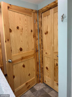 Custom doors and linen closet in bathroom