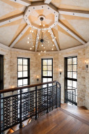 Photo for 835 Hunt Farm Road, Long Lake, MN 55356 - Listing #5693151 The design in the iron railing is duplicated throughout the home both inside and out. Beautiful windows grace the turret-style staircase