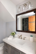 Photo for 835 Hunt Farm Road, Long Lake, MN 55356 - Listing #5693151 The second bedroom features this ensuite bathroom with Carrara marble countertop and designer tile tub surround.