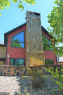 Photo for 8201 Strongbow Drive NE, Bemidji, MN 56601 - Listing #5765072 Main Level Patio Fireplace and Climbing Wall 2