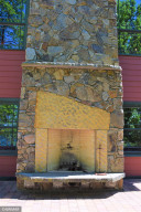 Photo for 8201 Strongbow Drive NE, Bemidji, MN 56601 - Listing #5765072 Main Level Patio Fireplace and Climbing Wall 1
