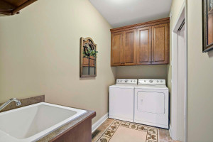 Photo for 18359 Justice Way, Lakeville, MN 55044 - Listing #5758983 walk-thru laundry room with utility tub, extra storage - and pocket door for privacy
