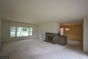 Photo for 115 7th Street S, Hudson, WI 54016 - Listing #6082782 Large living room with wood-burning fireplace and is adjacent to the dining room.