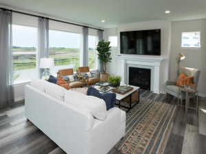 Photo for 11612 Brayburn Trail, Dayton, MN 55369 - Listing #6095318 The main floor living room will be a favorite gathering space for everyone. The wall of windows brings the outdoors inside. Cuddle up on chilly fall evenings next to the cozy gas fireplace.