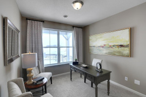 The 2nd main floor bedroom is a great space for an office, guest room or whatever best suits your needs. *All photos are of a former model home, please inquire for details.