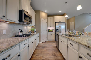 Photo for 18352 Hamel Drive, Lakeville, MN 55044 - Listing #6092594 Spacious kitchen with large walk-in corner pantry. *All photos are of a former model home, please inquire for details.