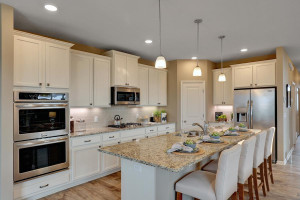 The stunning Morgan kitchen includes stunning finishes such as granite counter tops, tile backsplash, built-in wall ovens, gas cooktop, upgraded cabinetry & much more! *All photos are of a former model home, please inquire for details.