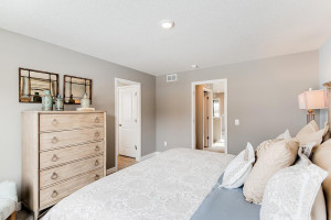 Photo for 13116 Zachary Lane N, Dayton, MN 55327 - Listing #6093893 A second view of the Primary Suite, seen here with a King sized bed and the access point to the room's Primary bathroom!! (Photo of same plan, colors are similar)