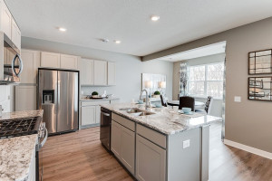 Photo for 13116 Zachary Lane N, Dayton, MN 55327 - Listing #6093893 The view lookout from the kitchen is equally impressive, as it pours into the homes dining area on one side, and into the main level family space on the other! (Photos of the same floorplan, colors are similar).