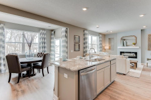 Photo for 13116 Zachary Lane N, Dayton, MN 55327 - Listing #6093893 The view lookout from the kitchen is equally impressive, as it pours into the homes dining area on one side, and into the main level family space on the other! (Photos of the same floorplan, colors are similar).