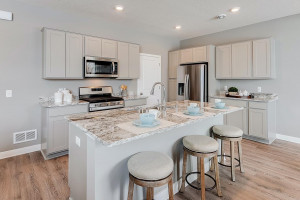 Photo for 13116 Zachary Lane N, Dayton, MN 55327 - Listing #6093893 A kitchen built to perform - complete with stainless appliances and a vented microhood, stunning cabinetry and loads of space to maneuver about!! (Photos of the same floorplan, colors are similar).