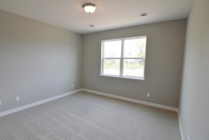 Photo for 13205 Deerwood Lane N, Dayton, MN 55327 - Listing #6097796 Way off in the back corner of the main level is this Primary suite - which offers the perfect setting to start and end each day and includes this massive window overlooking the park off the back of the home! (Photo of same plan, colors are similar)