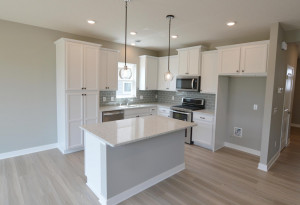 Photo for 13205 Deerwood Lane N, Dayton, MN 55327 - Listing #6097796 A kitchen built to perform - complete with an island, pantry closet, stainless appliance package including a vented microhood and double-oven gas range! (Photo of same plan, colors are similar)