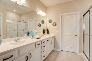 Photo for 13633 Applewood Trail, Rosemount, MN 55068 - Listing #6098803 Tucked back adjacent to the primary suite, this oversized bath features a walk-in shower, and 36-inch high dual vanities - plenty of storage! *Photo of previous model, selections will vary.