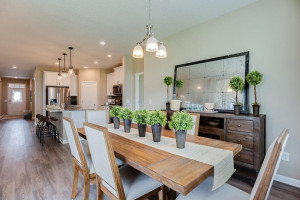 Photo for 13633 Applewood Trail, Rosemount, MN 55068 - Listing #6098803 Grab a meal at the island, or utilize this dining space - which features soaring windows allowing plenty of natural light to stream into the space and overlooks the home's deck! *Photo of previous model, selections will vary.