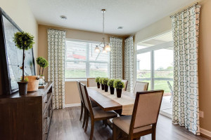 Photo for 13633 Applewood Trail, Rosemount, MN 55068 - Listing #6098803 Grab a meal at the island, or utilize this dining space - which features soaring windows allowing plenty of natural light to stream into the space and overlooks the home's deck! *Photo of previous model, selections will vary.