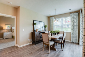 Photo for 13633 Applewood Trail, Rosemount, MN 55068 - Listing #6098803 Grab a meal at the island, or utilize this dining space - which features soaring windows allowing plenty of natural light to stream into the space and overlooks the home's deck! *Photo of previous model, selections will vary.