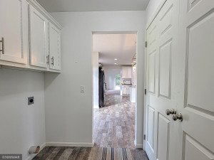Photo for 9582 Boneset Drive NW, Bemidji, MN 56601 - Listing #6100488 Laundry and hall leading from garage to dining