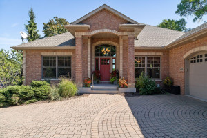 Photo for 6900 Minnewashta Parkway, Excelsior, MN 55331 - Listing #6098438 The beautiful paver driveway leads up the inviting front door.