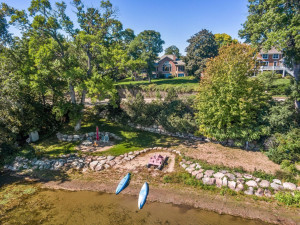 Photo for 6900 Minnewashta Parkway, Excelsior, MN 55331 - Listing #6098438 Professionally landscaped, the shoreline features a sandy beach and paver patio with a custom campfire ring.