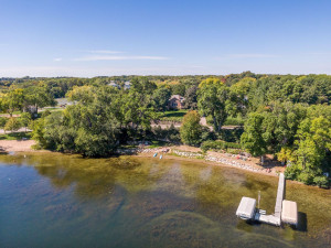Photo for 6900 Minnewashta Parkway, Excelsior, MN 55331 - Listing #6098438 The property features over 140-feet of riprapped shoreline with a sandy bottom.