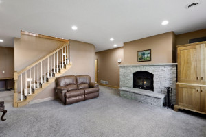Photo for 6900 Minnewashta Parkway, Excelsior, MN 55331 - Listing #6098438 The lower level family room enjoys a second wood burning fireplace.