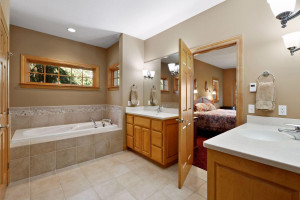 Photo for 6900 Minnewashta Parkway, Excelsior, MN 55331 - Listing #6098438 A private spa, the master bathroom features heated tile floors, separate comfort-height vanities and a large jetted bathtub.