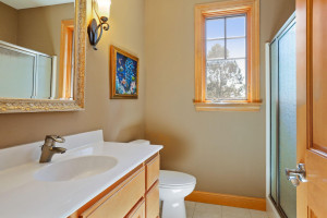 Photo for 6900 Minnewashta Parkway, Excelsior, MN 55331 - Listing #6098438 Just off the mud room is a 3/4 guest bathroom with an elevated vanity, designer mirror and tiled flooring.