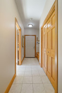 Photo for 6900 Minnewashta Parkway, Excelsior, MN 55331 - Listing #6098438 There is ample storage in this mud room which features two coat closets, a broom closet and built-in boot bench.
