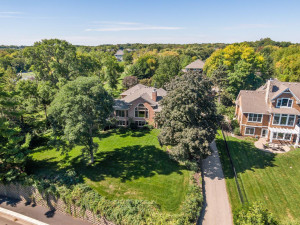 Photo for 6900 Minnewashta Parkway, Excelsior, MN 55331 - Listing #6098438 Lush landscaping and large trees surround the home.
