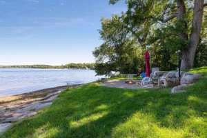 Photo for 6900 Minnewashta Parkway, Excelsior, MN 55331 - Listing #6098438 Professionally landscaped, the shoreline features a sandy beach and paver patio wit ha campfire ring.