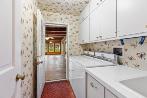 Photo for 765 Sibley Drive, Northfield, MN 55057 - Listing #6110010 The laundry room, accessed by both the porch and the bedroom area, has plenty of overhead cabinet storage and a sink for hand washing clothes.