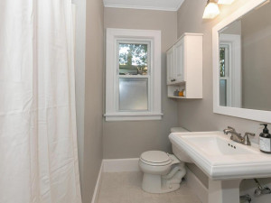 Photo for 991 Stryker Avenue, West Saint Paul, MN 55118 - Listing #6109307 Main floor full bathroom with tiled flooring, white decor and millwork.